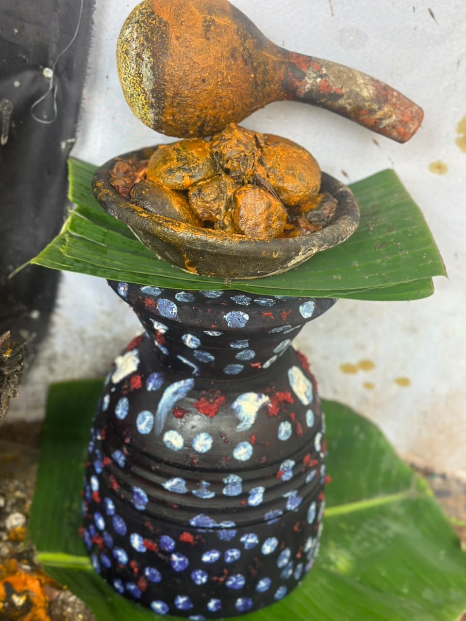 A sacred vessel prepared with leaves and traditional materials